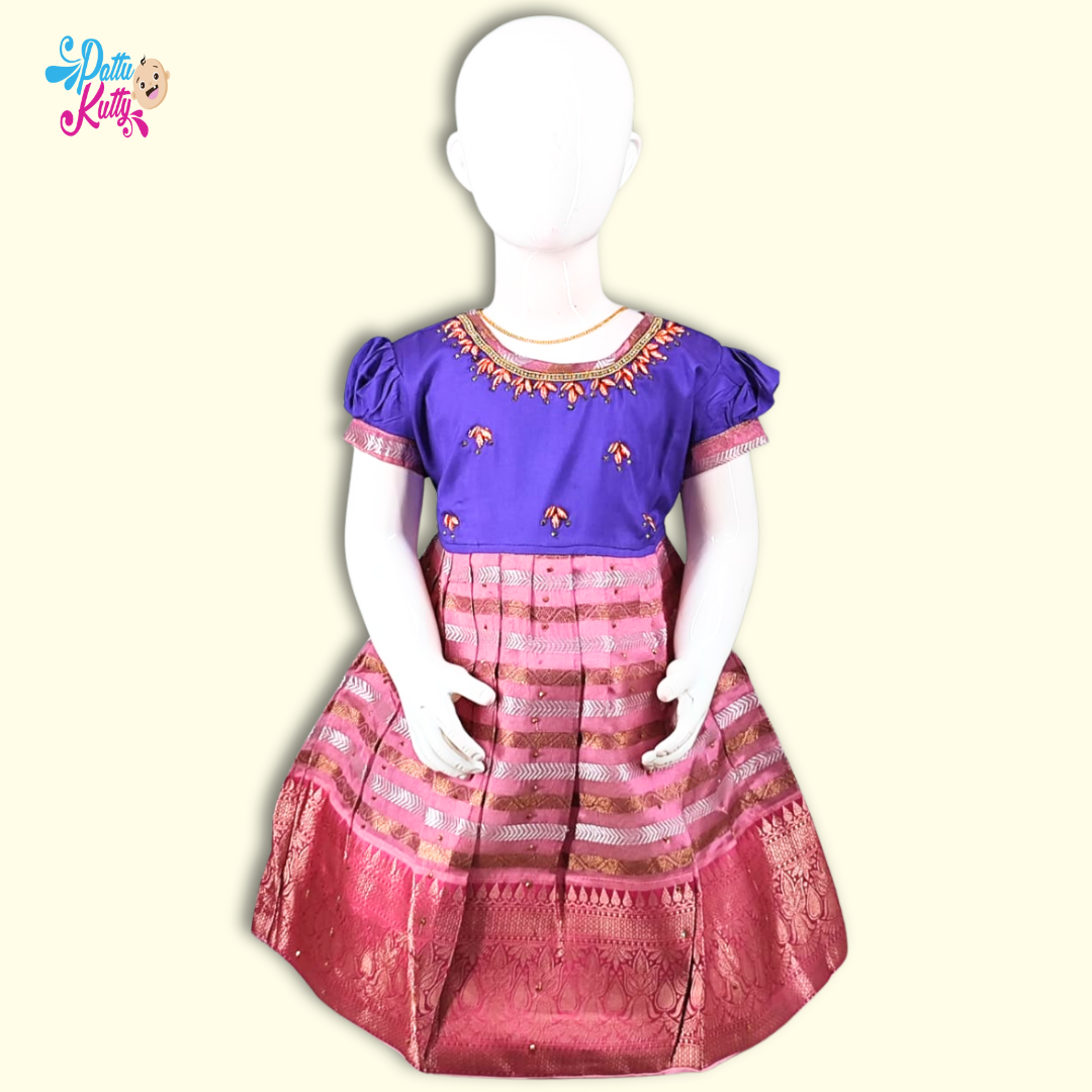 This Pattu Frock comes in combination with Blue Stone work top and Pink printed skirt with Large border.