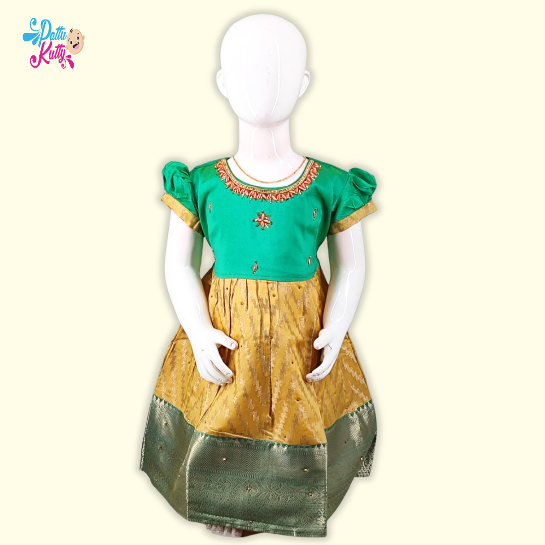 This Pattu Frock comes in combination with Green Stone work top with Yellow printed skirt with Green border.