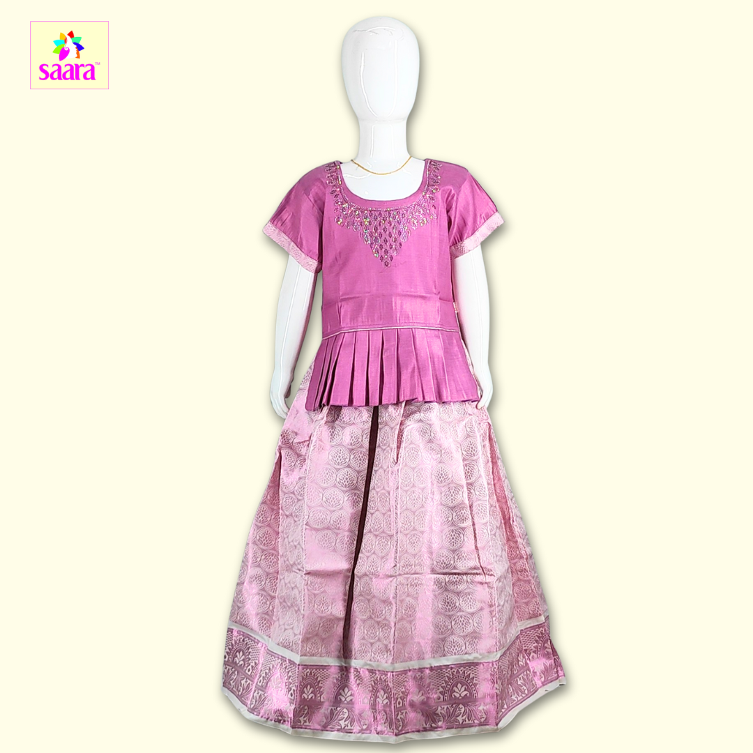 This pattupavadai fetures Pink an top with ironing stone work and frill at the bottom of top and paired with pink skirt.
