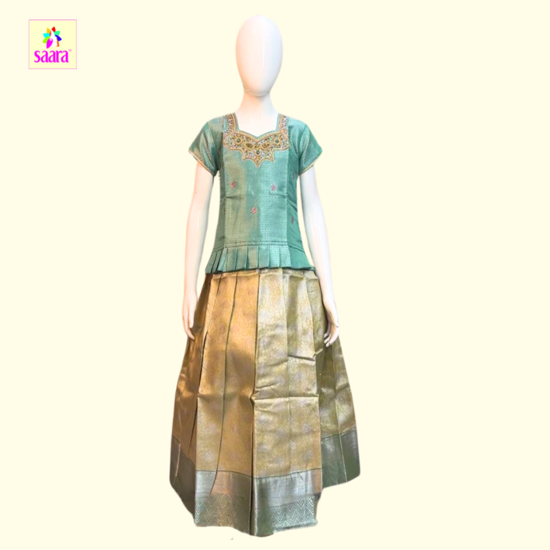 Green and Gold pattu pavadai with Green Aari work top with Frill design, and Gold printed skirt with zari border.