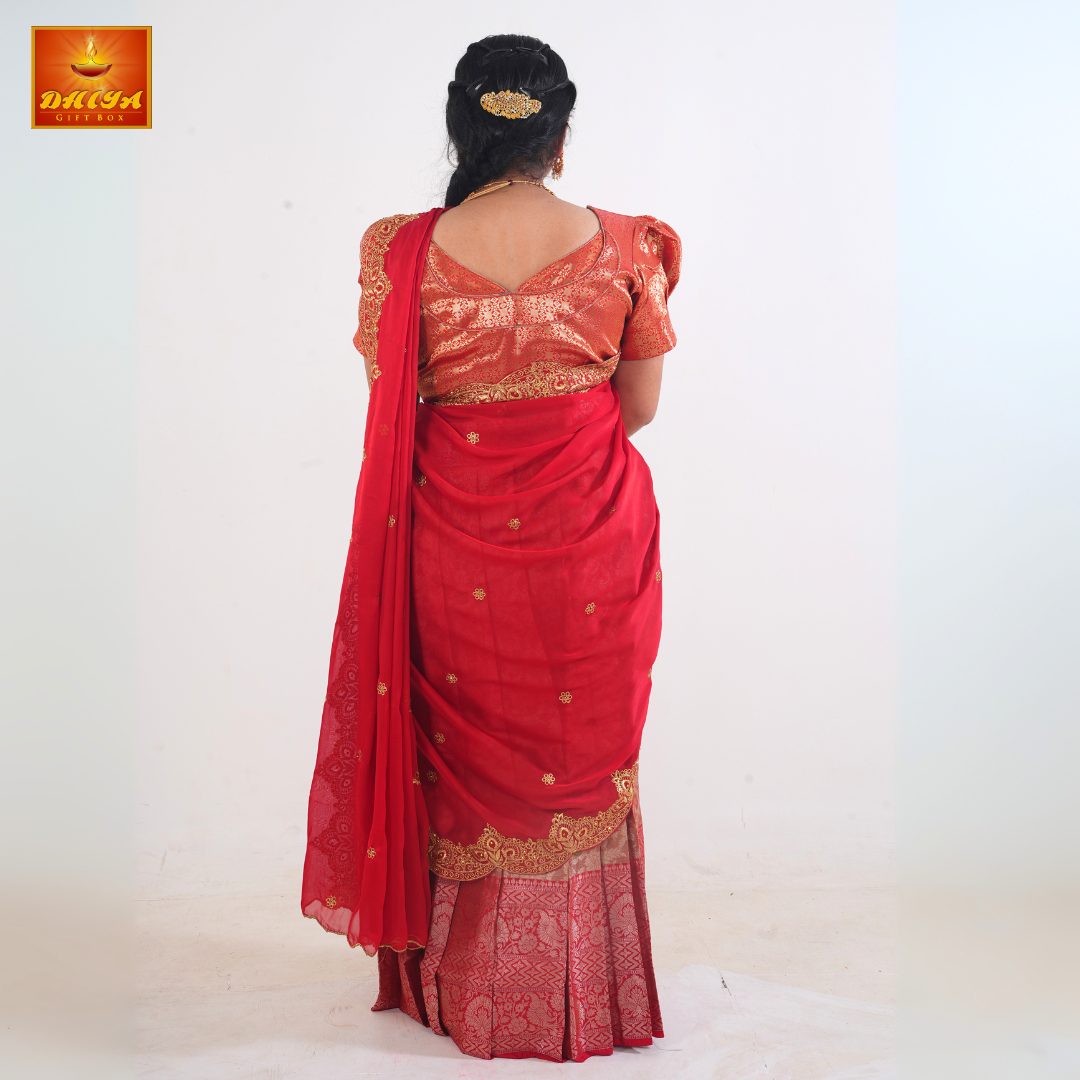 This Half saree features Red shawl with embellishment at the hem and peach floral printed Skirt ,Zari border, and matching Puff sleeve with patterned blouse.