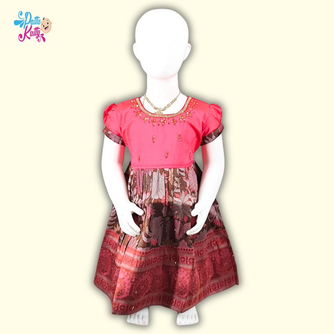 This Pattu Frock comes in combination with Pink Stone work top with Brown printed skirt.