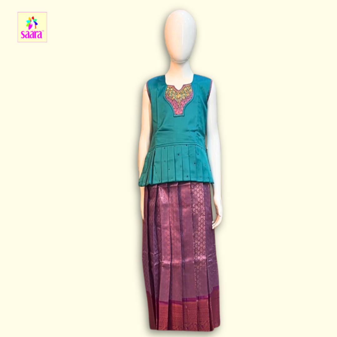 This Pattu Pavadai with embroidered neckline and Frill design and printed skirt ang Copper border.