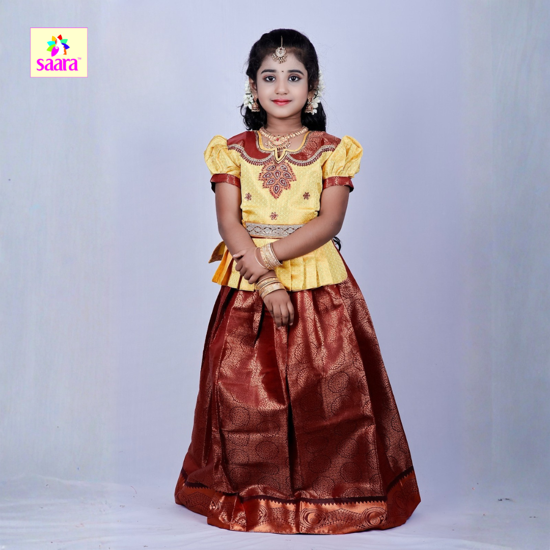 This Pattu Pavadai features yellow colour top with Aari and Patch work combined with Maroon colour Skirt.