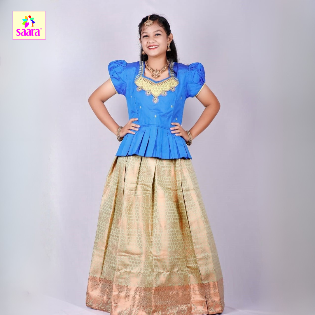 This pattu pavadai features a Sky Blue blouse with Stone work& Patch work and Frill design with a matching Light Green skirt made of jacquard fabric.