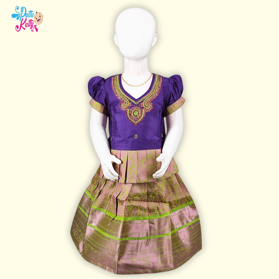  This Pattu Pavadai with Aari woked neckline with Frill Design and printed skirt with large border.