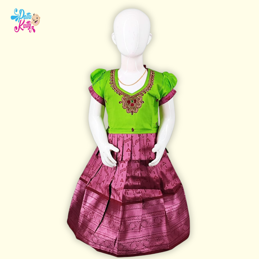 This Pattu Pavadai comes in combination with Green Stone work top with Frill Design and Pink printed skirt.