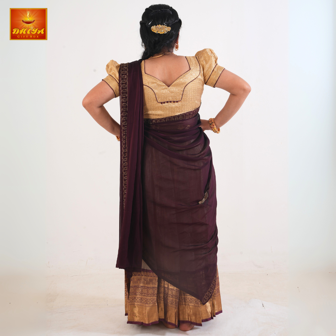 This Half saree features Brown shawl with embellishment at the hem and Beige plain Skirt ,Zari border, and matching Puff sleeve blouse with piping details and potli buttons.