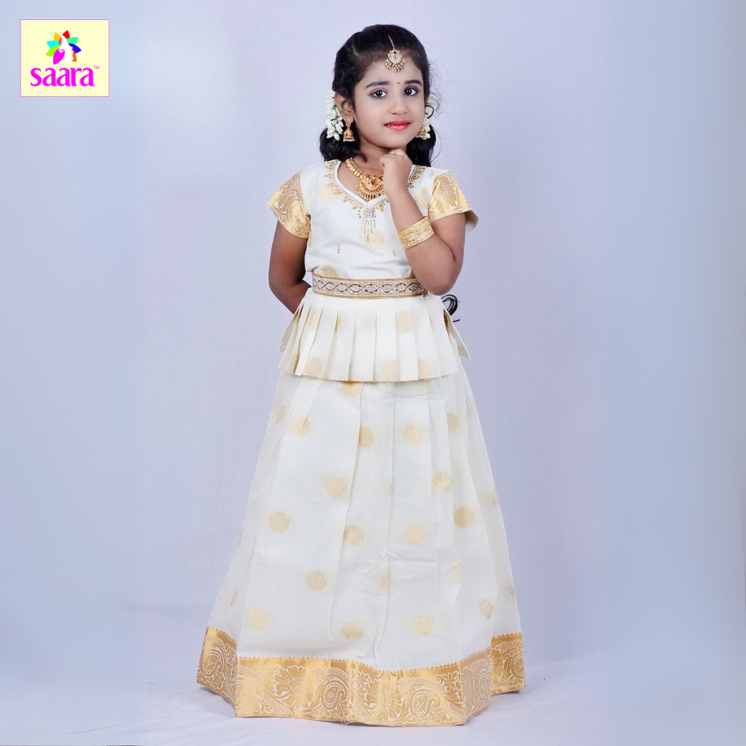 This Pattu Pavadai features puff-sleeve with white and gold combination with gold embellishment  and white handloom pattu skirt with polka dots. 