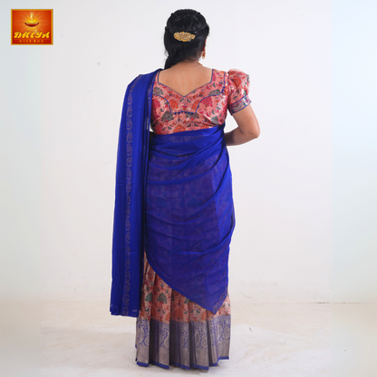 This Half saree with blue shawl with embellishment and peach floral printed Skirt ,Zari border, and matching Puff sleeve blouse with piping design with potli buttons.