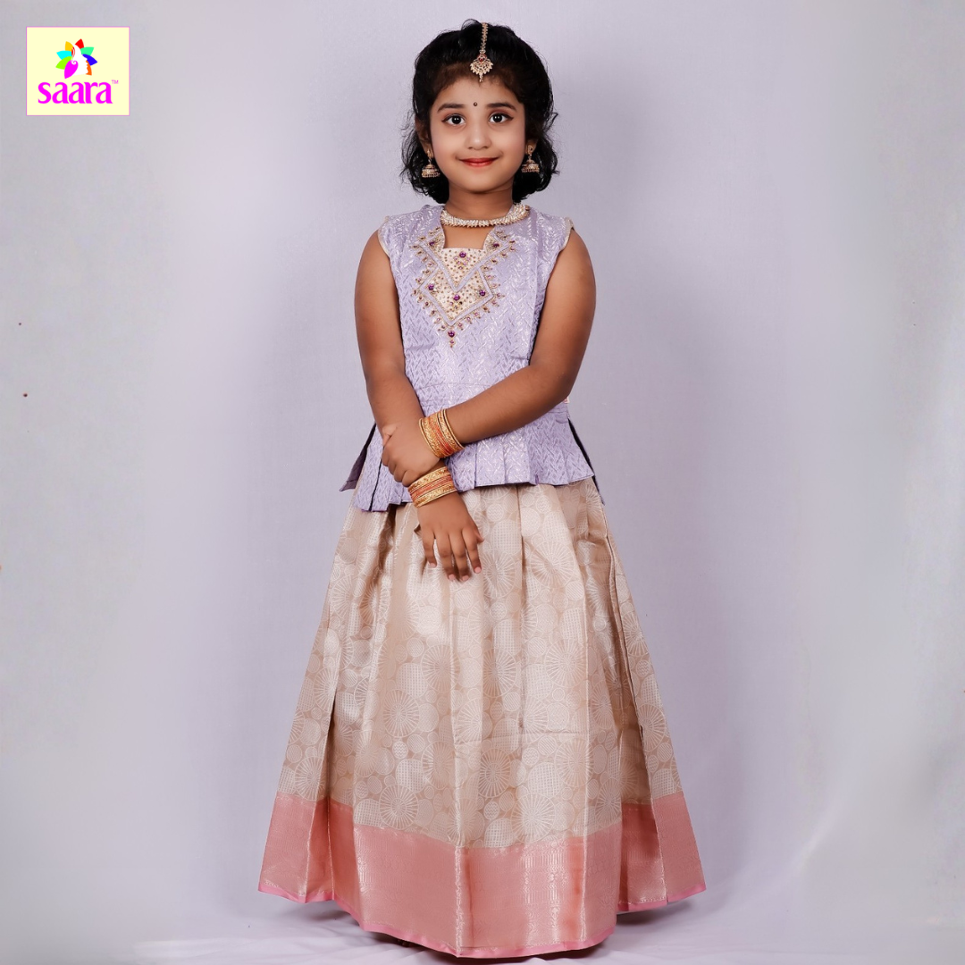 This Pattu pavadai features Lavender top with stone work with beige skirt with pink border.