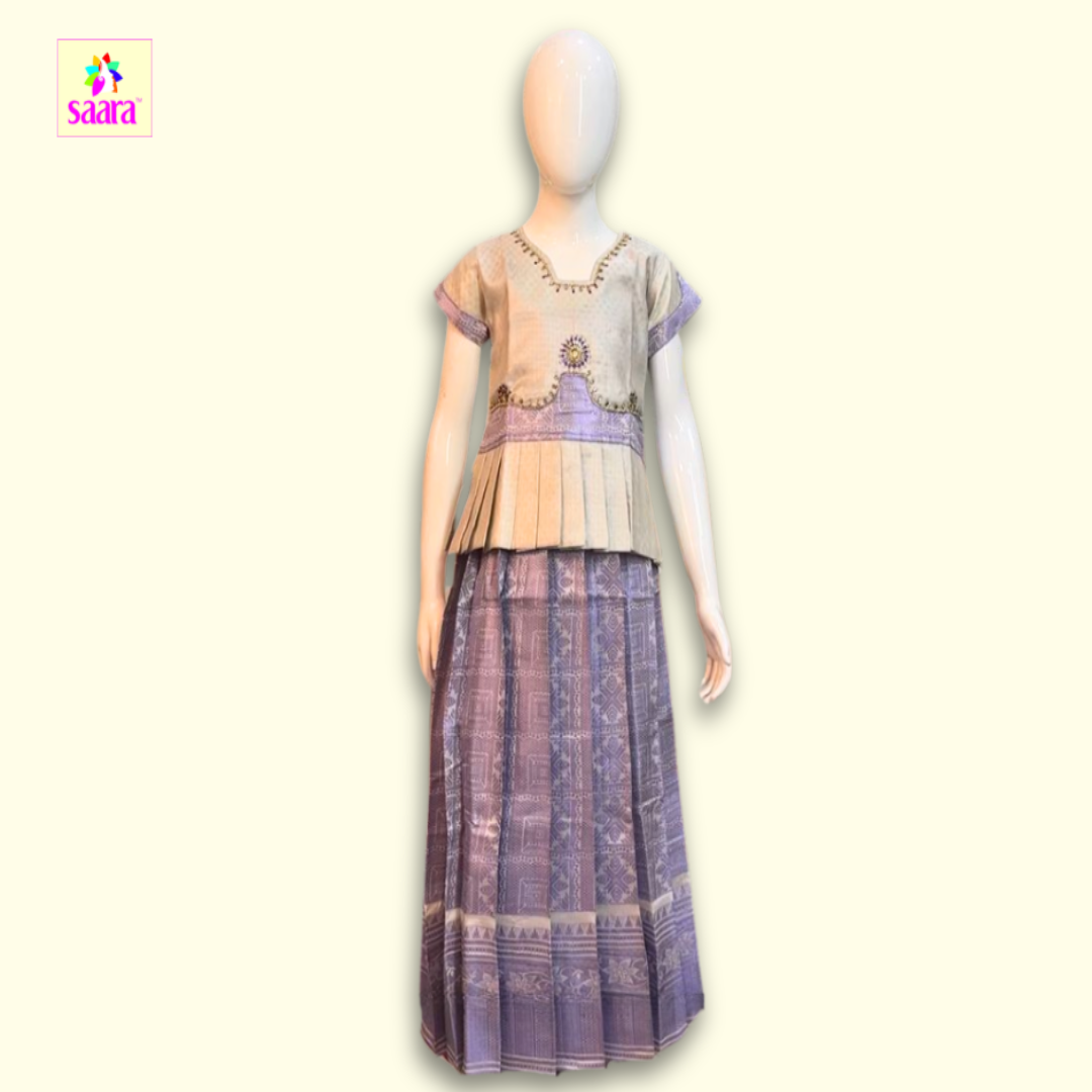 This Pattu Pavadai with stonework  worked top with frill design in Off white and Purple colour printed skirt 