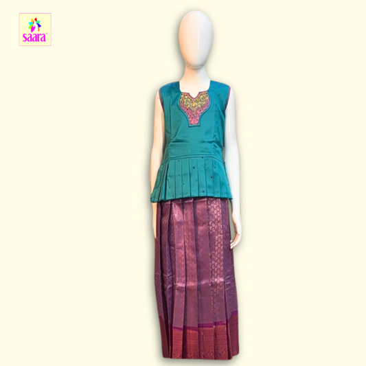 This Pattu Pavadai with embroidered neckline and Frill design and printed skirt ang Copper border.