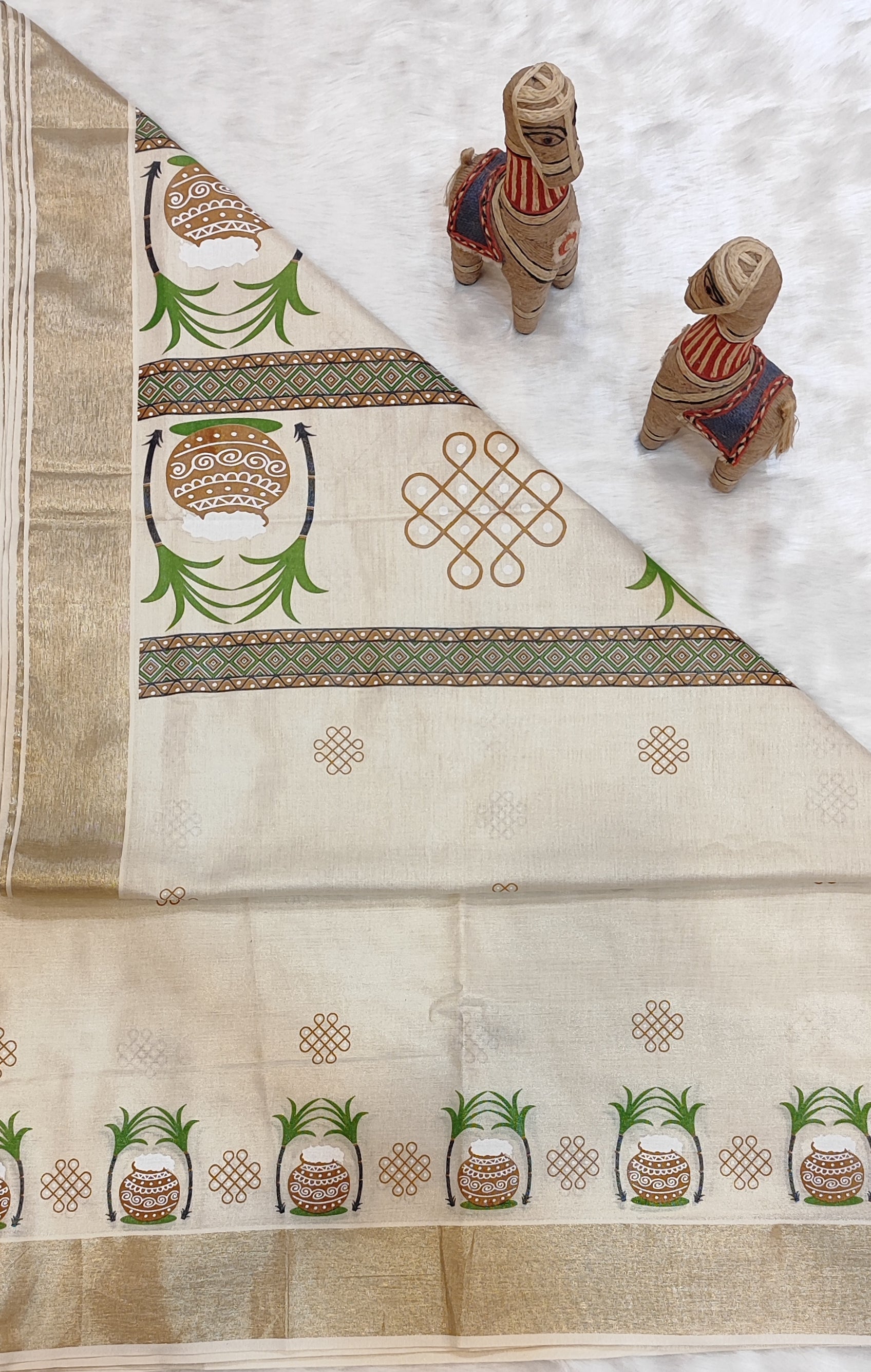 This saree has pongal and kolam prints with Running Blouse.